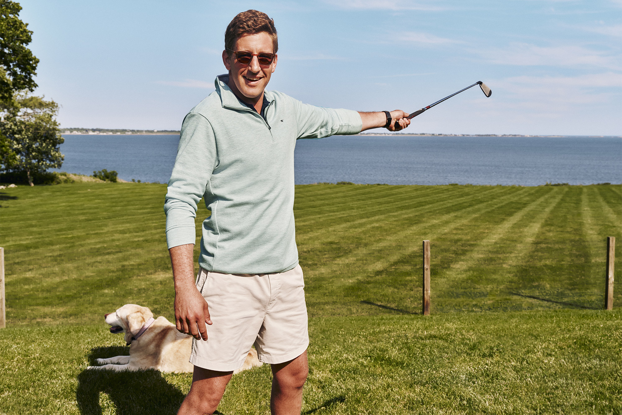 Andre brushes up on his short game while pup Kiko reads the green.