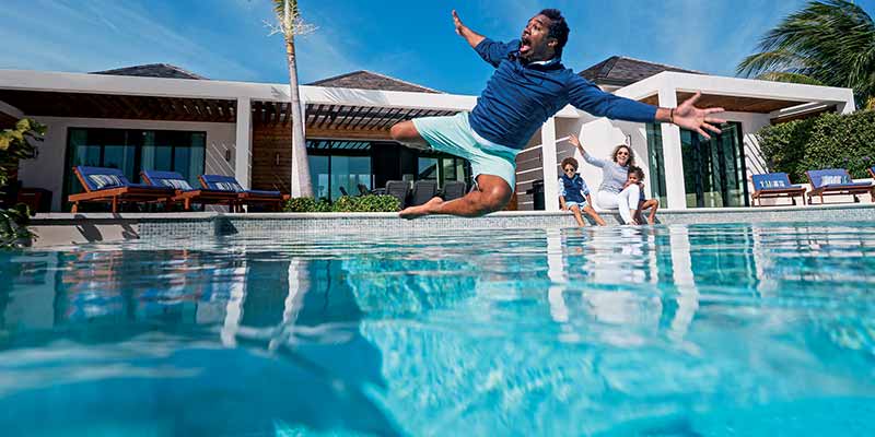 Dhani Jones jumping in the pool