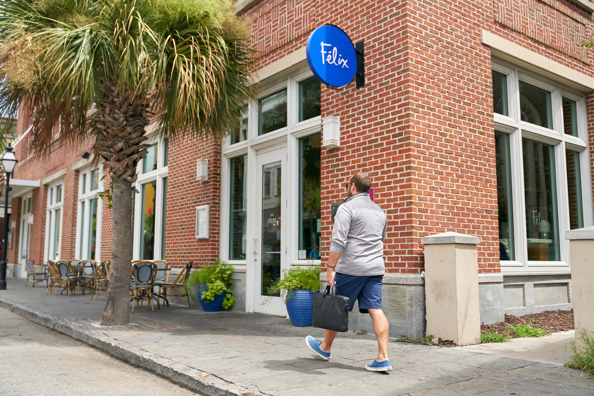 Félix Landrum walking in front of 'Félix'