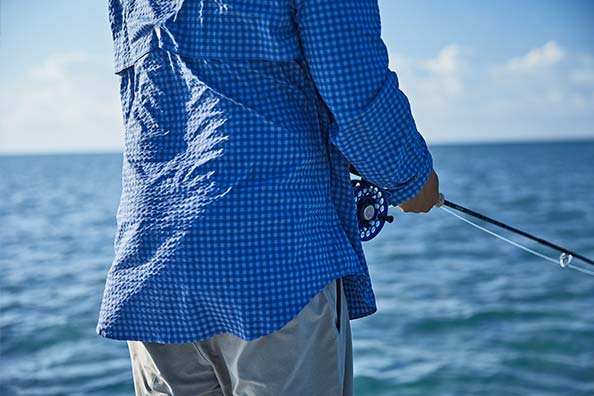 man fishing in vineyard vines harbor shirt