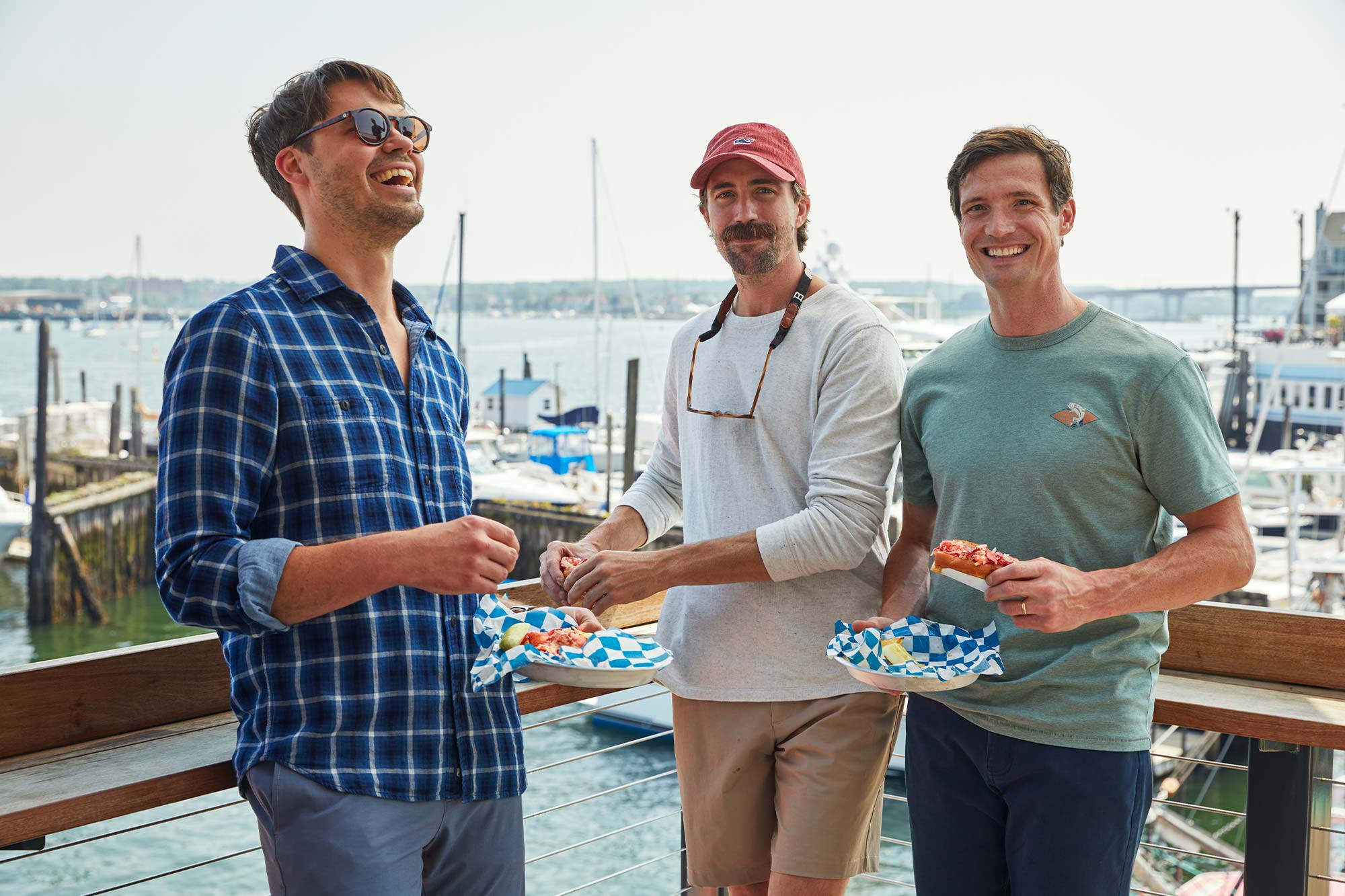 Luke, Bryan and Ben eating lobster rolls