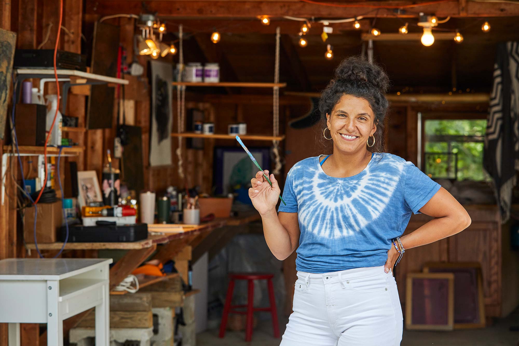 Jordan Parks holding paintbrush