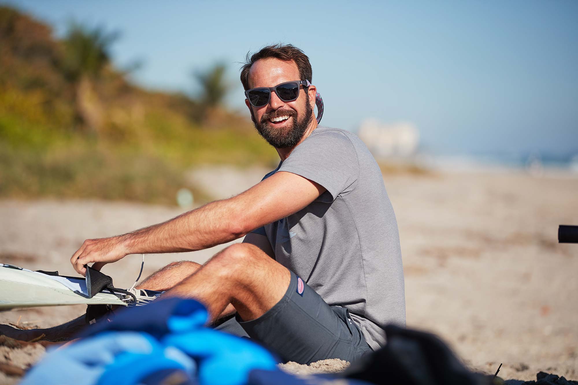 Philip Muller sitting in the sand