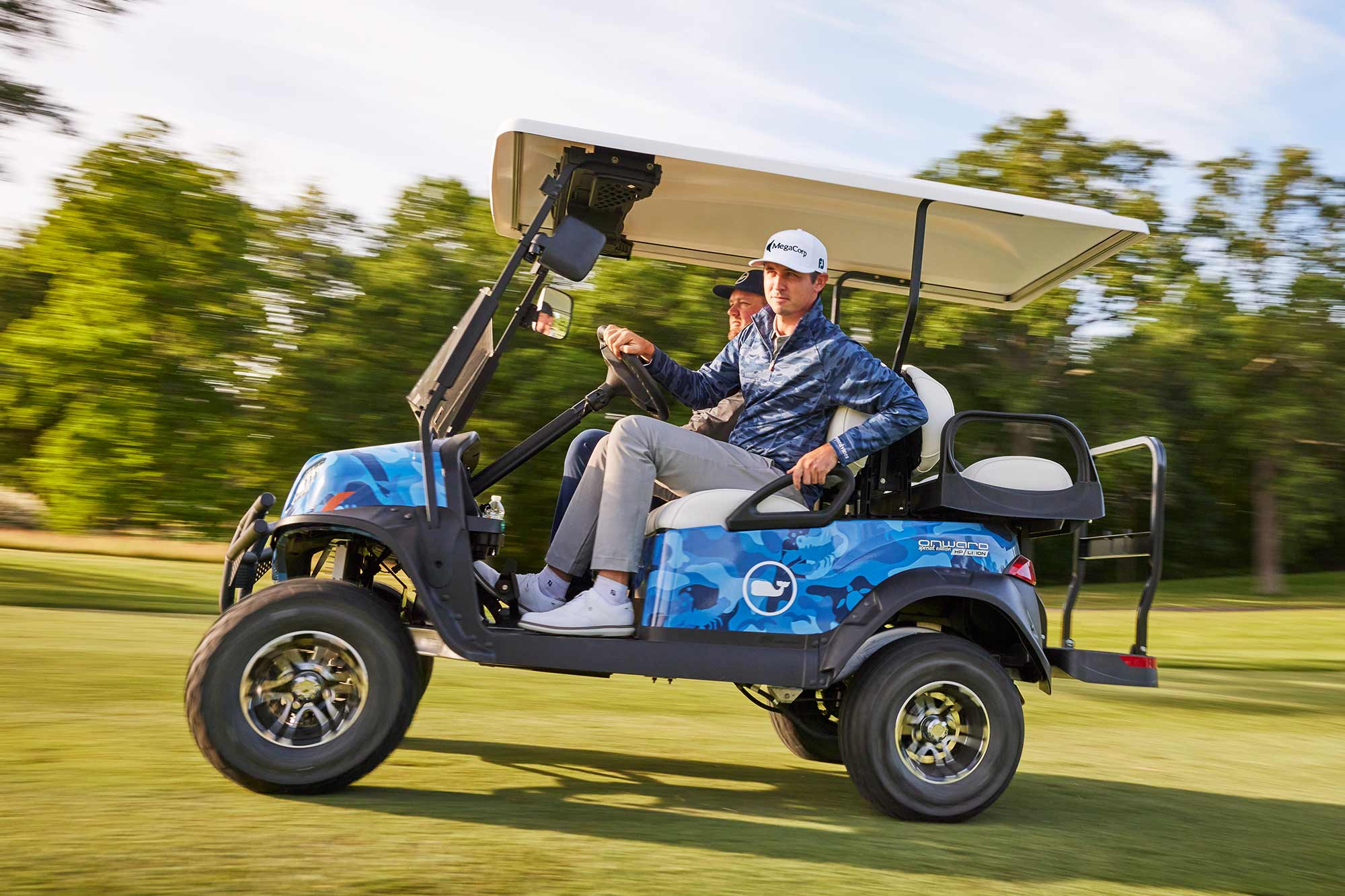 J.T. Poston and caddie in golf cart