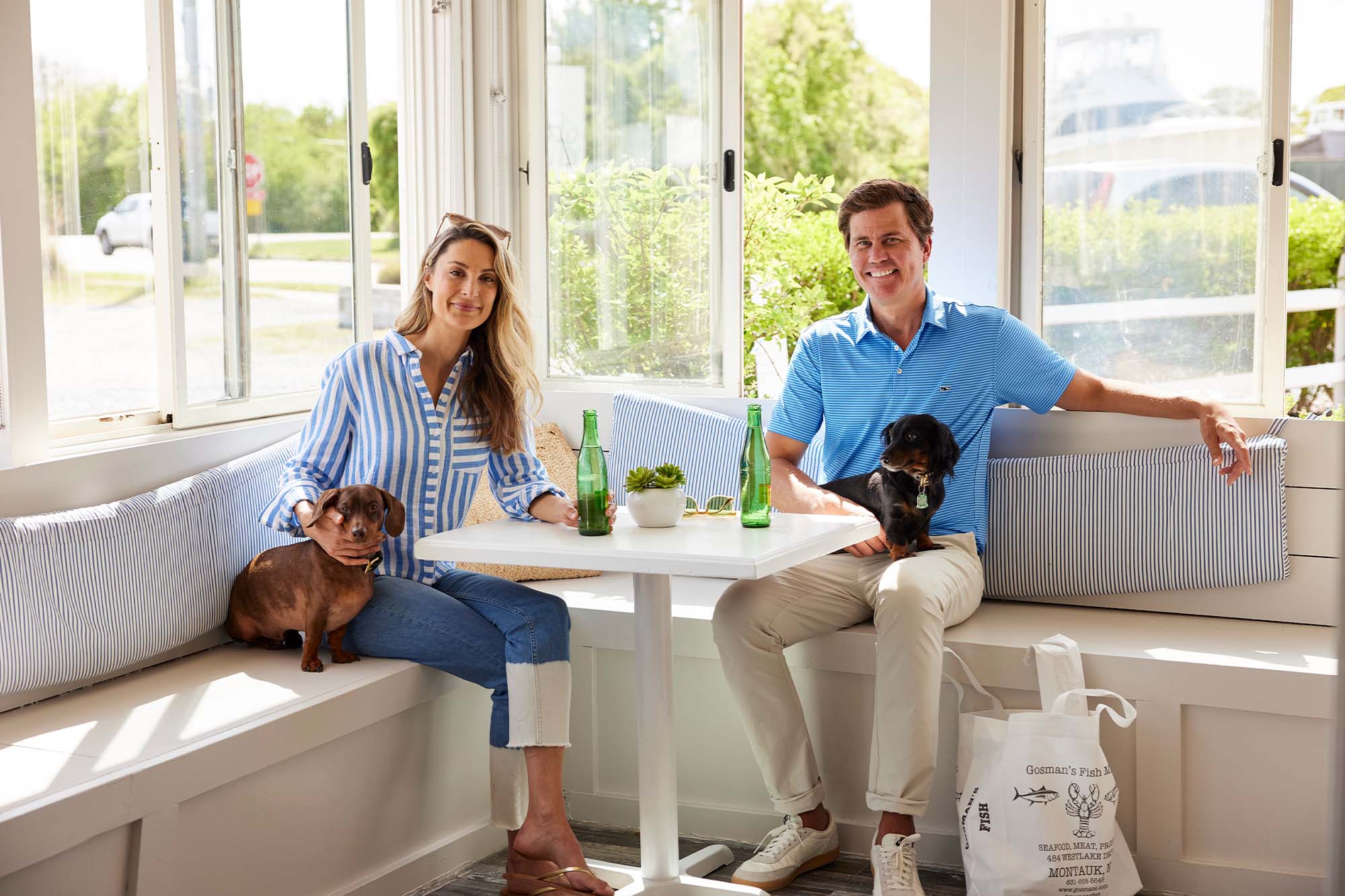Ryan Chadwick and his wife Emily Frantz sitting with their dogs