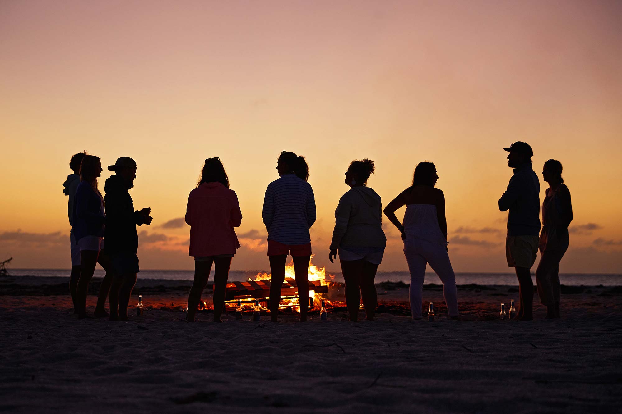 Matt Smukall with friends around firepit
