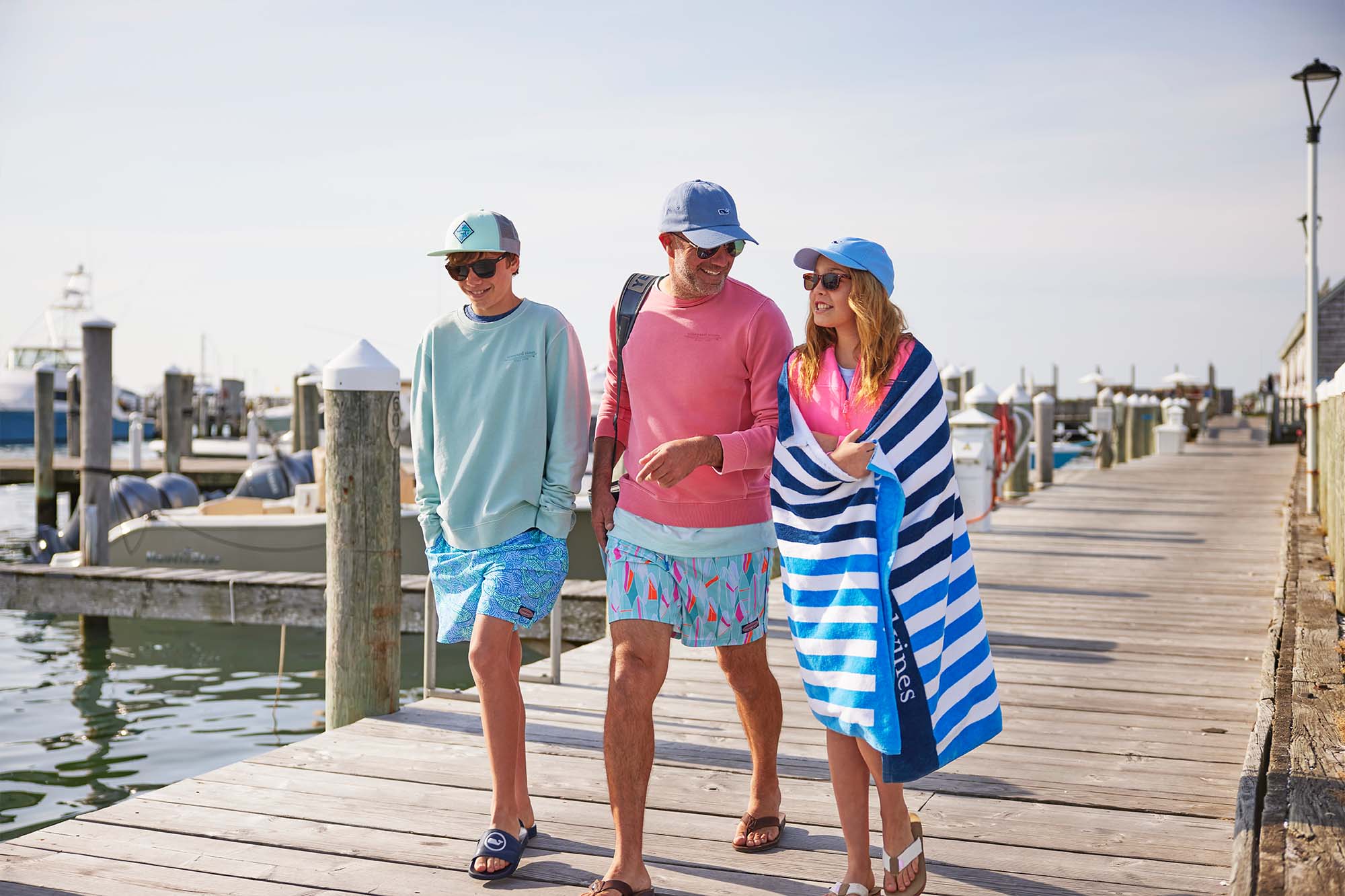 Bryan Goulart with his kids walking down a boardwalk