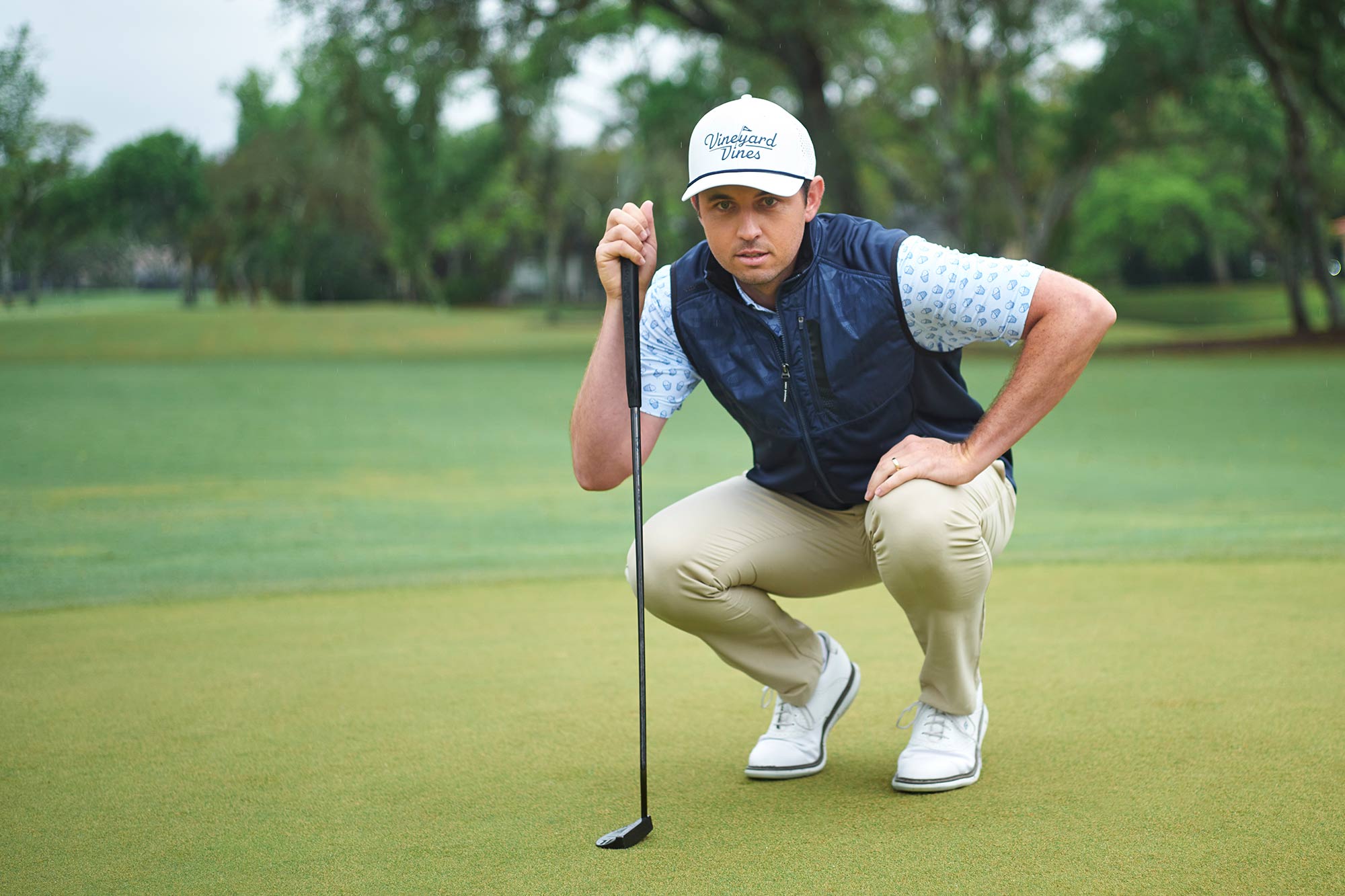 J.T. Poston reading the green