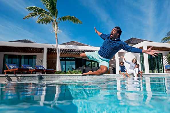 Dhani Jones jumping into pool