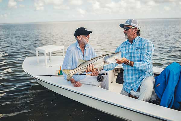 Sandy Moret holding fish