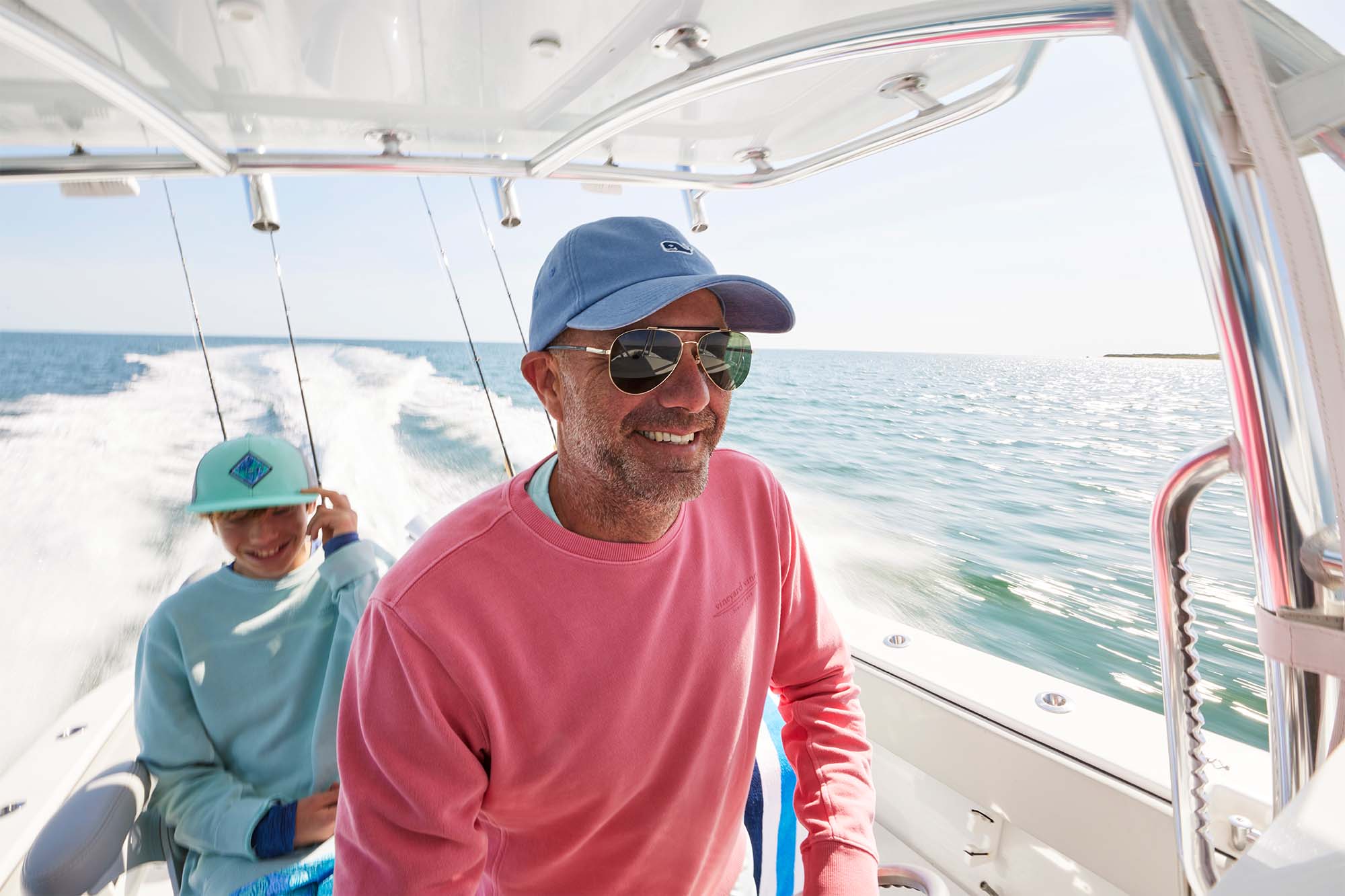 Bryan Goulart and son in a boat in the water